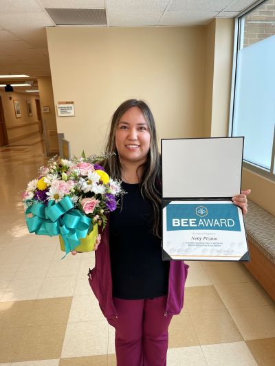 Netty Pizano with her awards