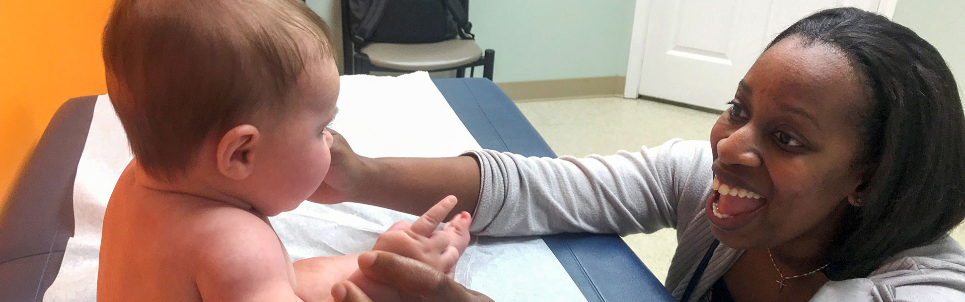 Dr Washington with a baby